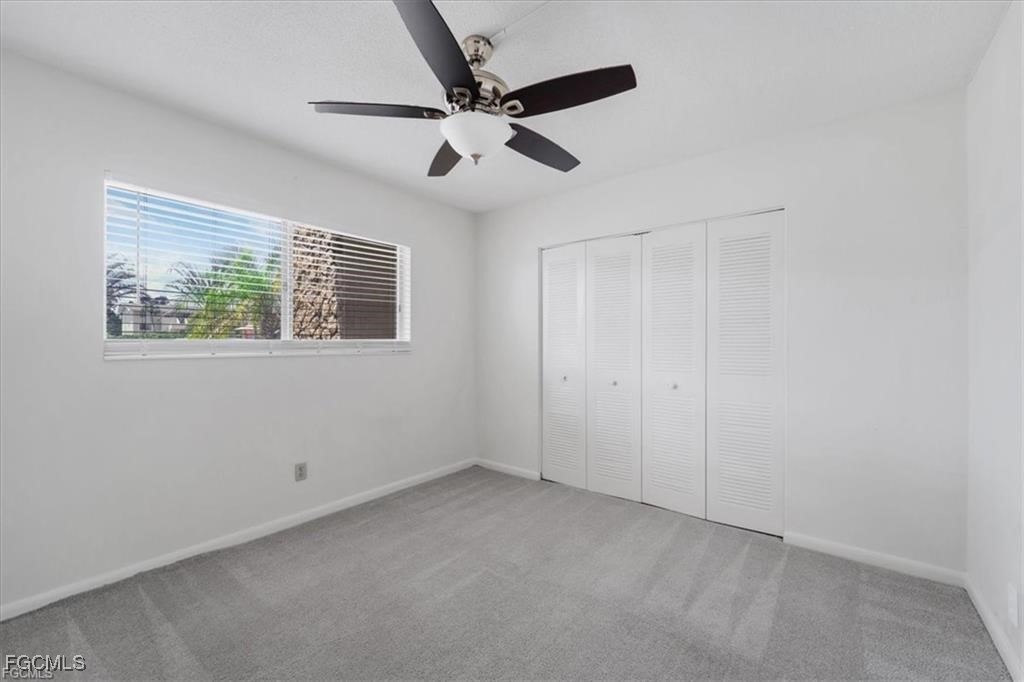 339 Joel Boulevard, Unit 121 Lehigh Acres, FL 33936 - Photo 8 of 40 a view of an empty room with a window