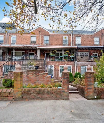 a front view of a house with garage
