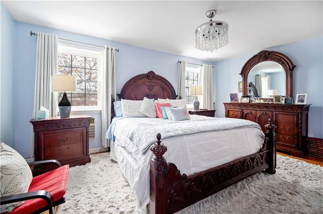 a bedroom with a bed and a dresser