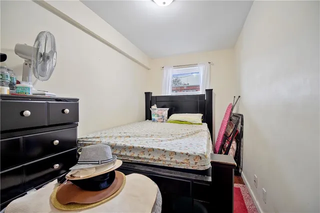a bedroom with a bed and cabinets