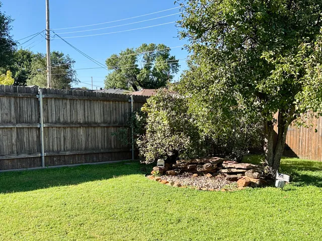 a view of a house with a backyard porch and sitting area