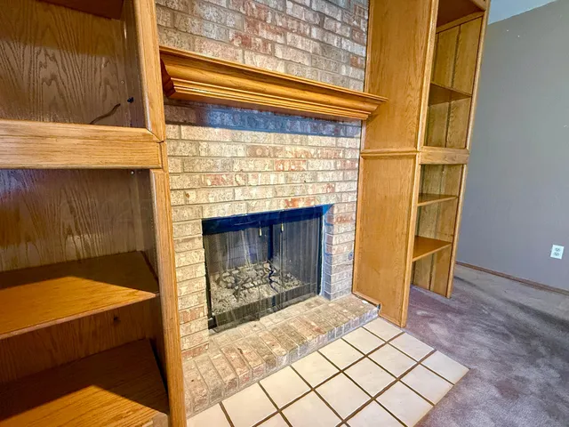 a living room with a fireplace
