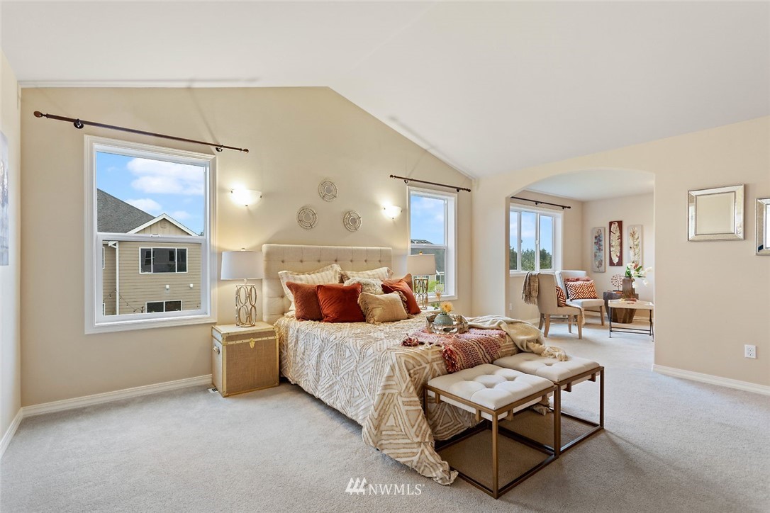 4124 215th Street Southeast Bothell, WA 98021 - Photo 11 of 30 a bedroom with a bed and wooden floor