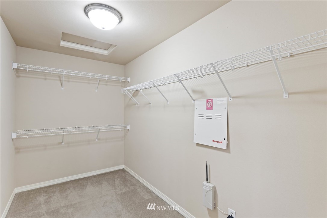 4124 215th Street Southeast Bothell, WA 98021 - Photo 15 of 30 a view of storage and utility room with racks on the wall
