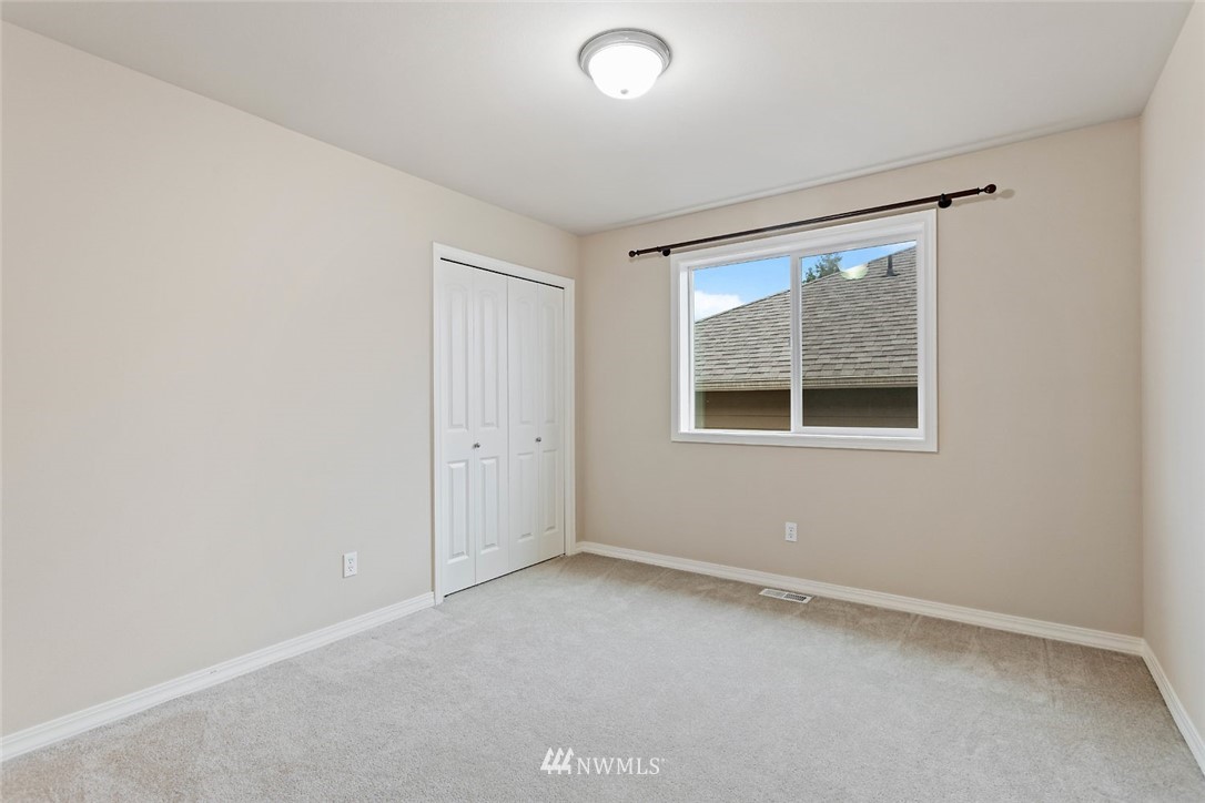 4124 215th Street Southeast Bothell, WA 98021 - Photo 17 of 30 an empty room with a window
