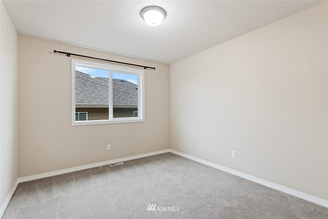 4124 215th Street Southeast Bothell, WA 98021 - Photo 18 of 30 an empty room with a window