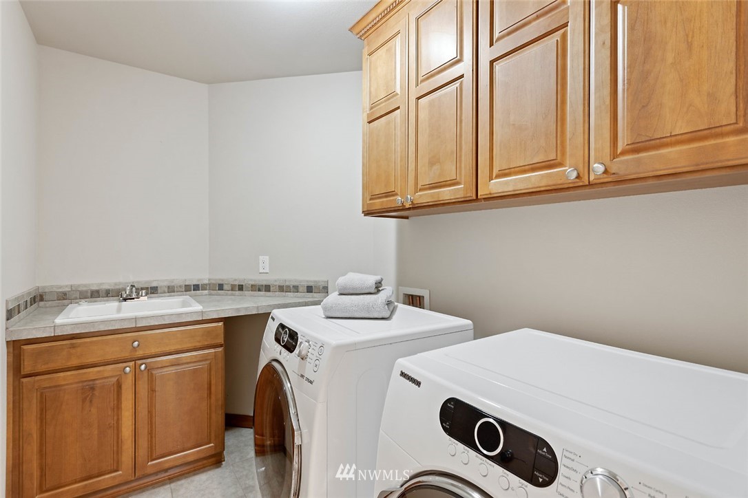 4124 215th Street Southeast Bothell, WA 98021 - Photo 19 of 30 a utility room with dryer and washer