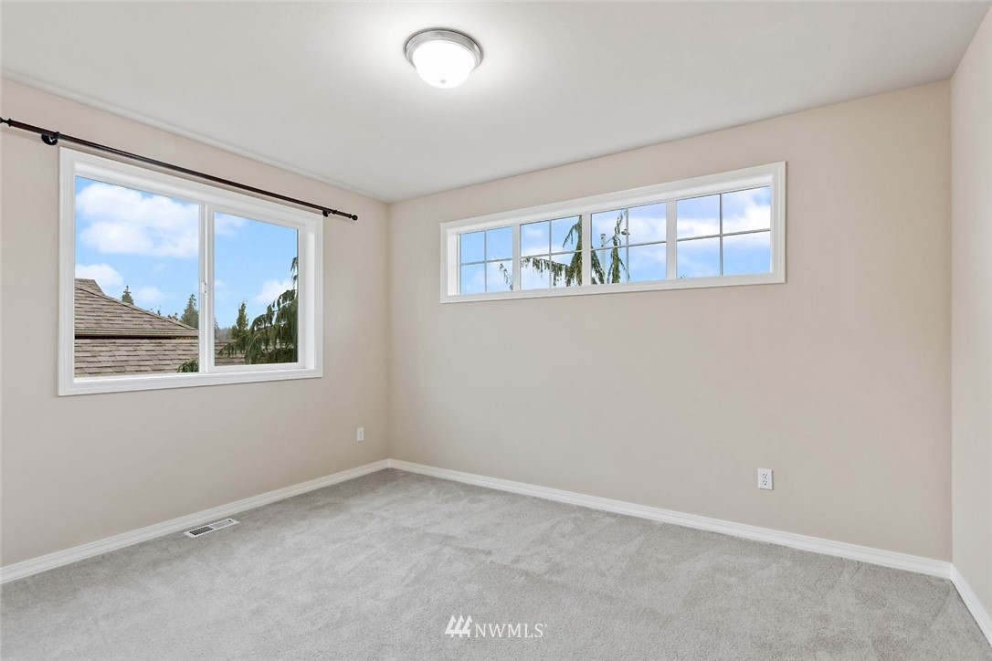 4124 215th Street Southeast Bothell, WA 98021 - Photo 20 of 30 an empty room with a window