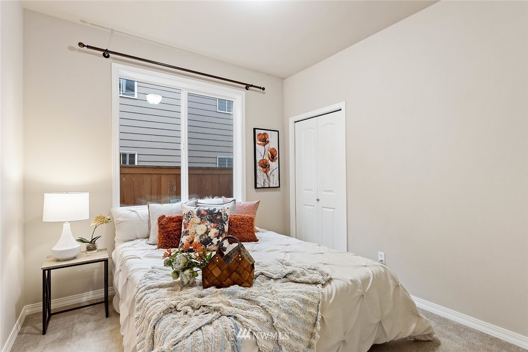 4124 215th Street Southeast Bothell, WA 98021 - Photo 22 of 30 a bed room with a bed furniture and a window