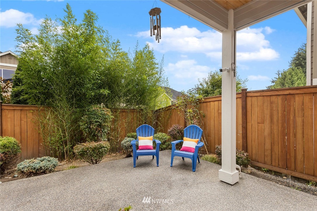 4124 215th Street Southeast Bothell, WA 98021 - Photo 26 of 30 a view of a two chairs in the back yard of the house