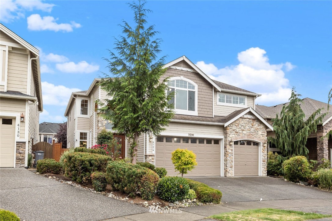 4124 215th Street Southeast Bothell, WA 98021 - Photo 30 of 30 a front view of a house with garden