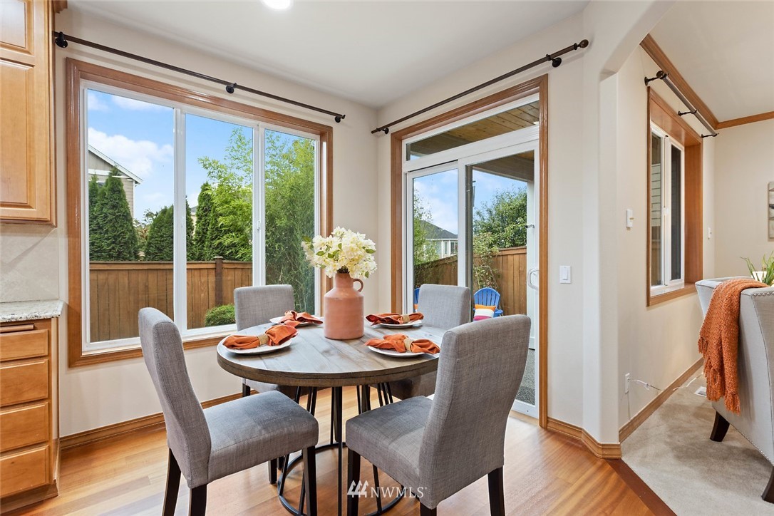 4124 215th Street Southeast Bothell, WA 98021 - Photo 6 of 30 a view of a dining room with furniture window and wooden floor