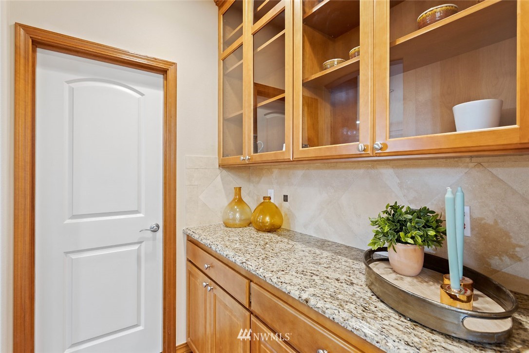 4124 215th Street Southeast Bothell, WA 98021 - Photo 7 of 30 a kitchen with a refrigerator and potted plant