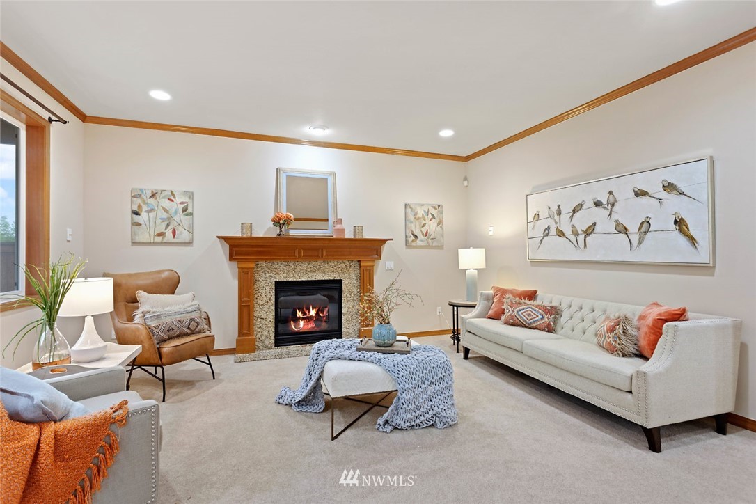 4124 215th Street Southeast Bothell, WA 98021 - Photo 9 of 30 a living room with furniture and a fireplace