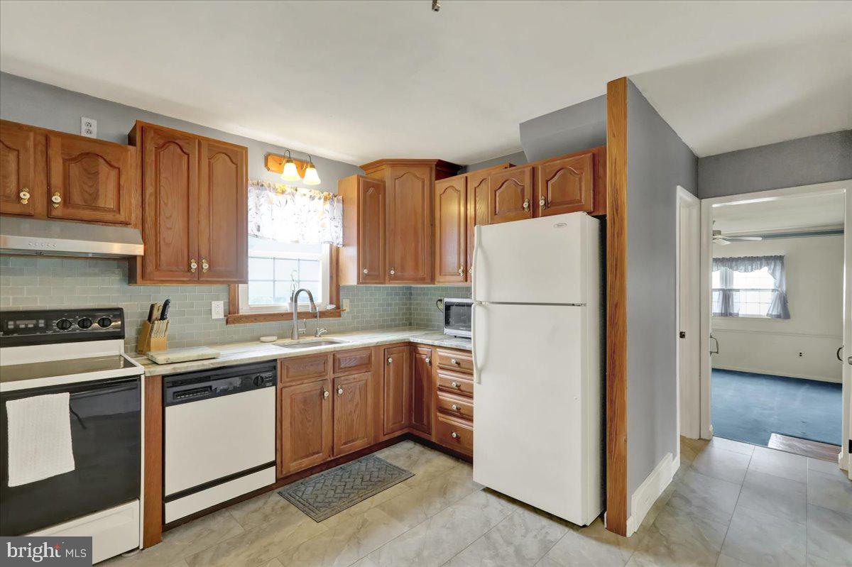 603 Governor Drive Reading, PA 19607 - Photo 17 of 41 a white refrigerator freezer sitting in a kitchen