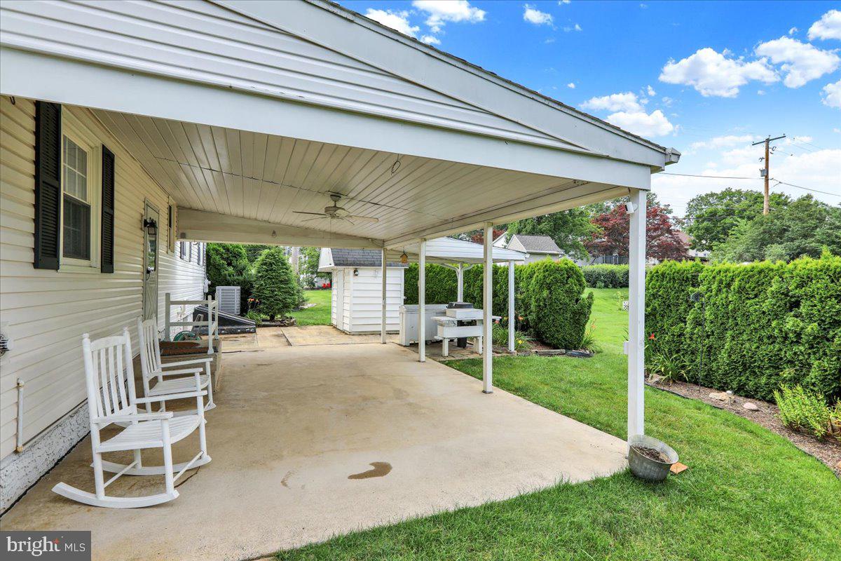603 Governor Drive Reading, PA 19607 - Photo 5 of 41 a view of a patio with a table and chairs and a garden