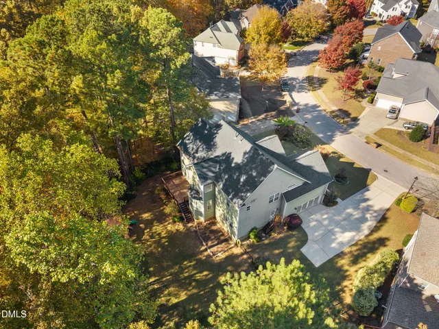 an aerial view of a house with a lake view