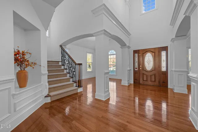 a view of a room with wooden floor and window