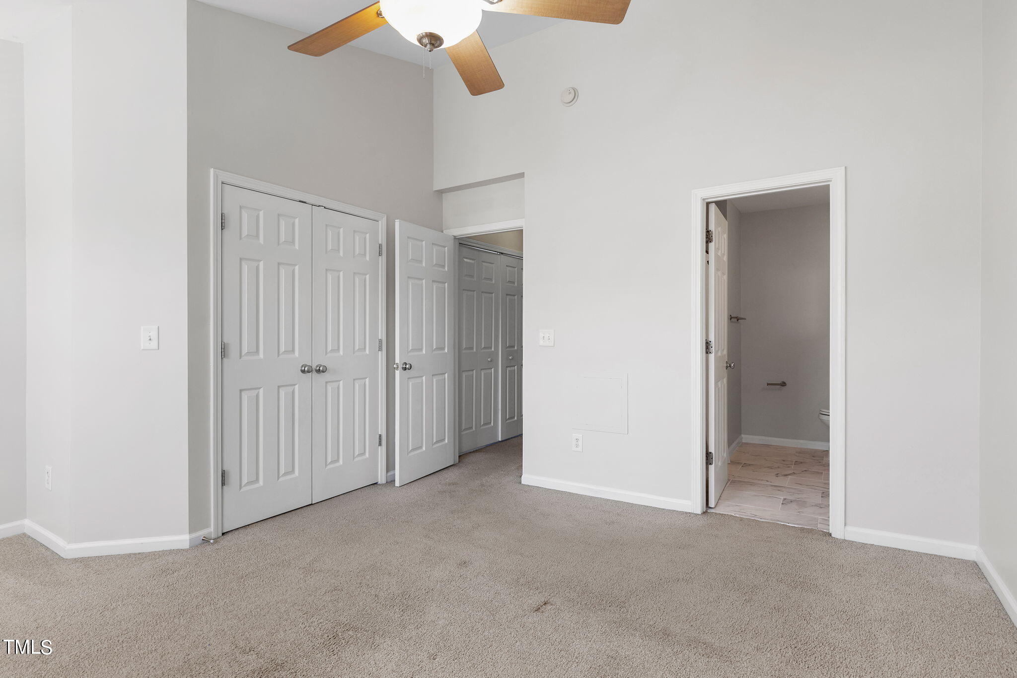 8330 City Loft Court Raleigh, NC 27613 - Photo 15 of 23 an empty room with a ceiling fan
