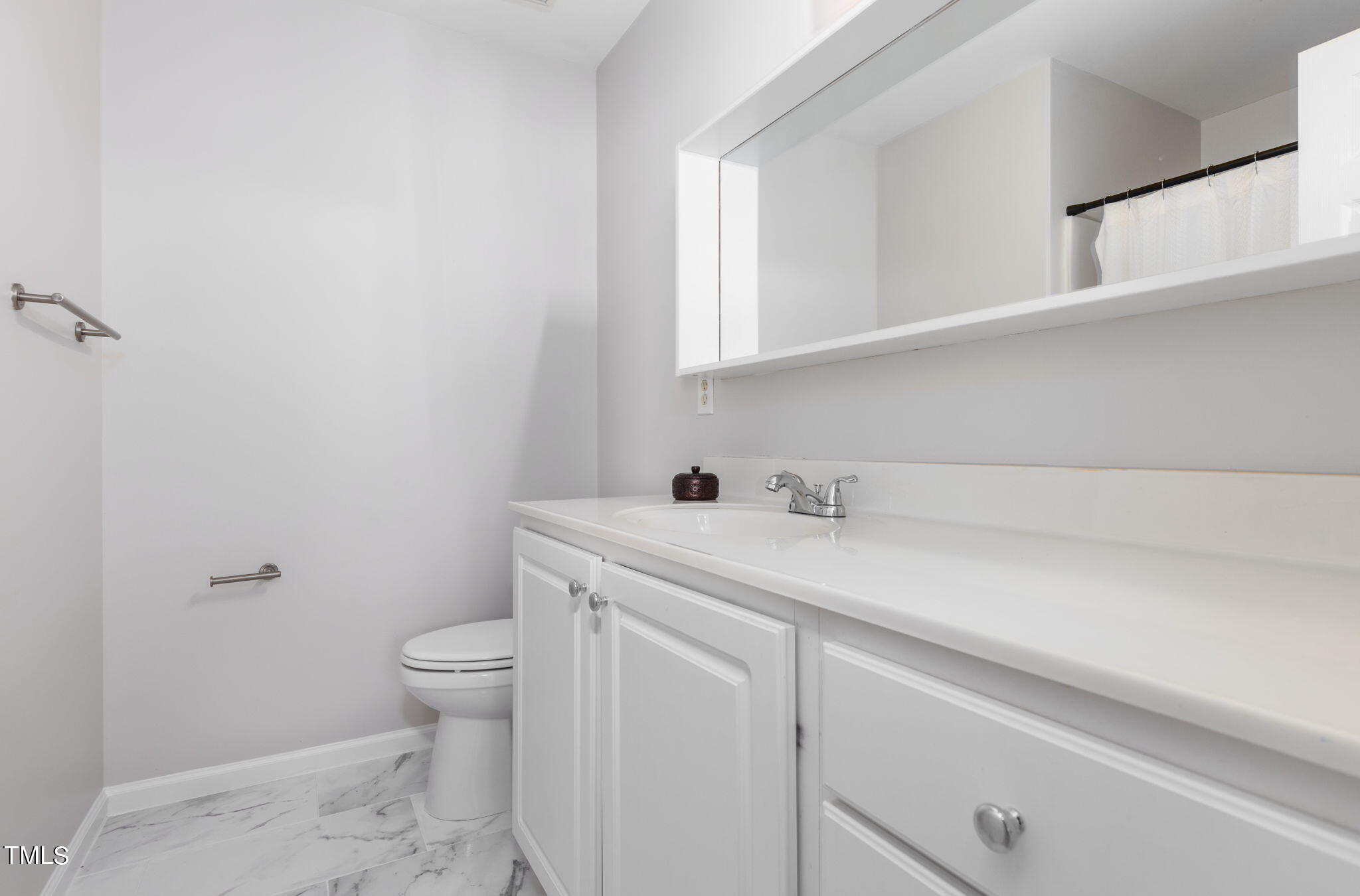 8330 City Loft Court Raleigh, NC 27613 - Photo 16 of 23 a view of bathroom with a sink and a toilet