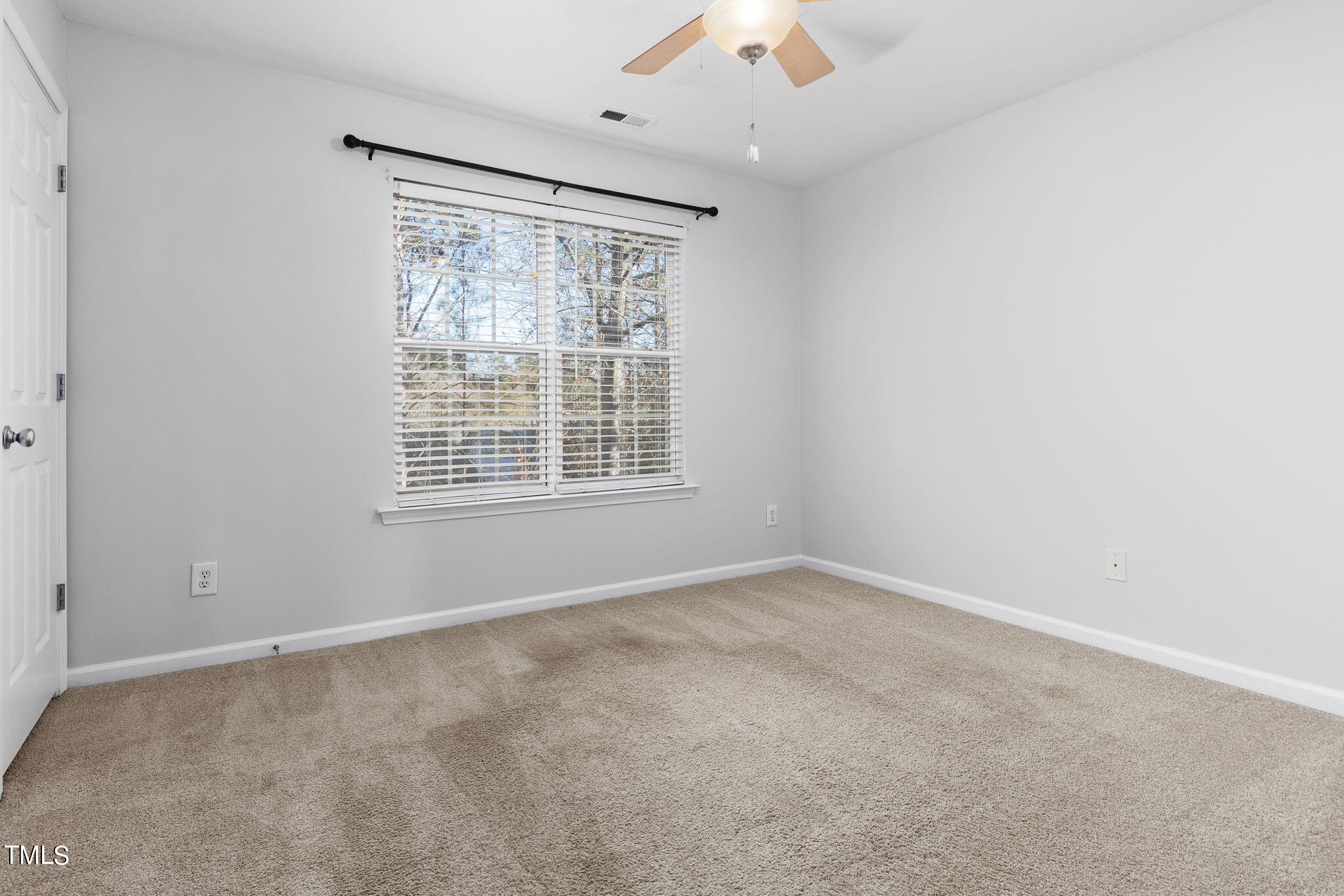 8330 City Loft Court Raleigh, NC 27613 - Photo 17 of 23 an empty room with a window
