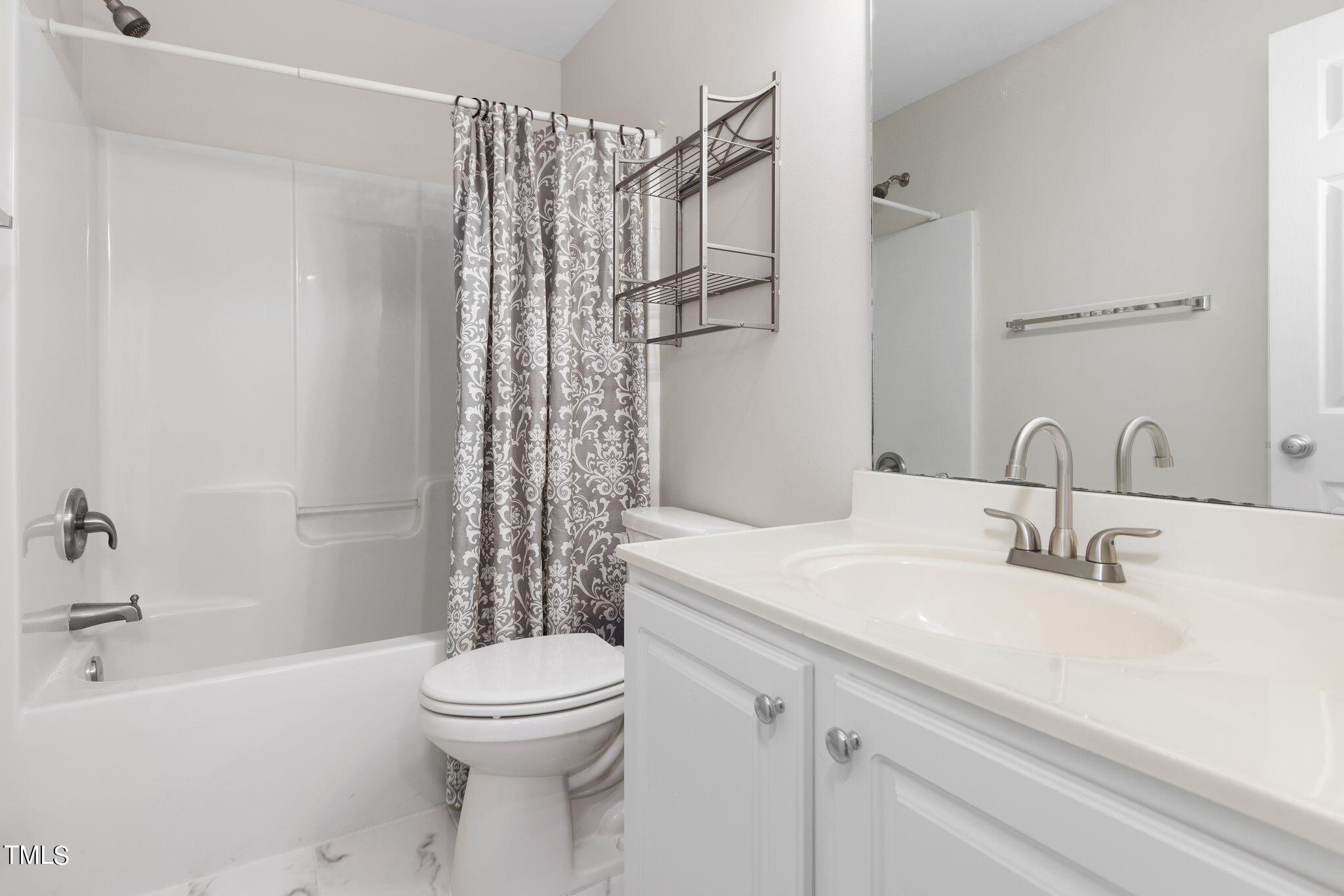 8330 City Loft Court Raleigh, NC 27613 - Photo 19 of 23 a bathroom with a sink toilet and shower