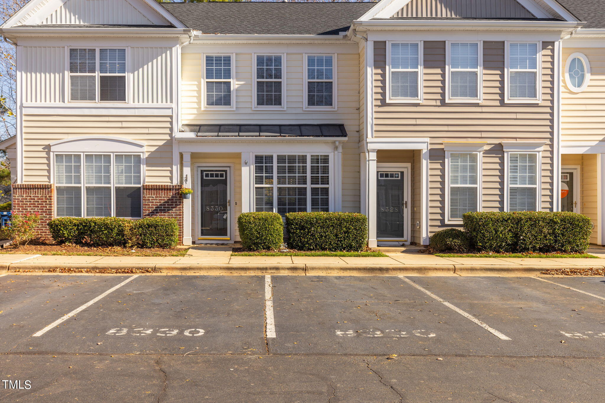 8330 City Loft Court Raleigh, NC 27613 - Photo 22 of 23 a front view of a house with a yard