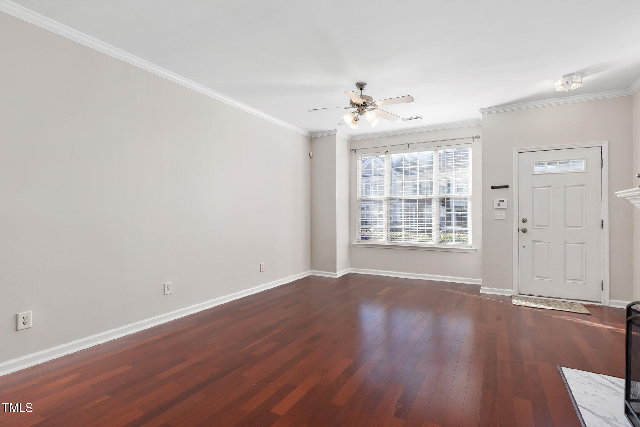 8330 City Loft Court Raleigh, NC 27613 - Photo 4 of 23 wooden floor in an empty room with a window