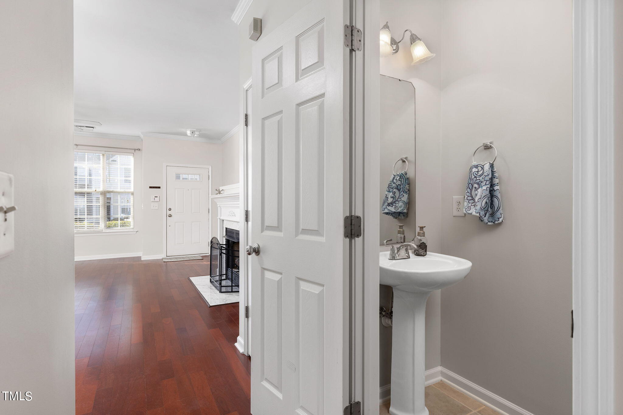 8330 City Loft Court Raleigh, NC 27613 - Photo 7 of 23 a bathroom with a sink a mirror and shower