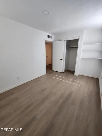 a view of an empty walk in closet
