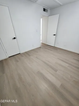 a view of balcony with wooden floor and city view