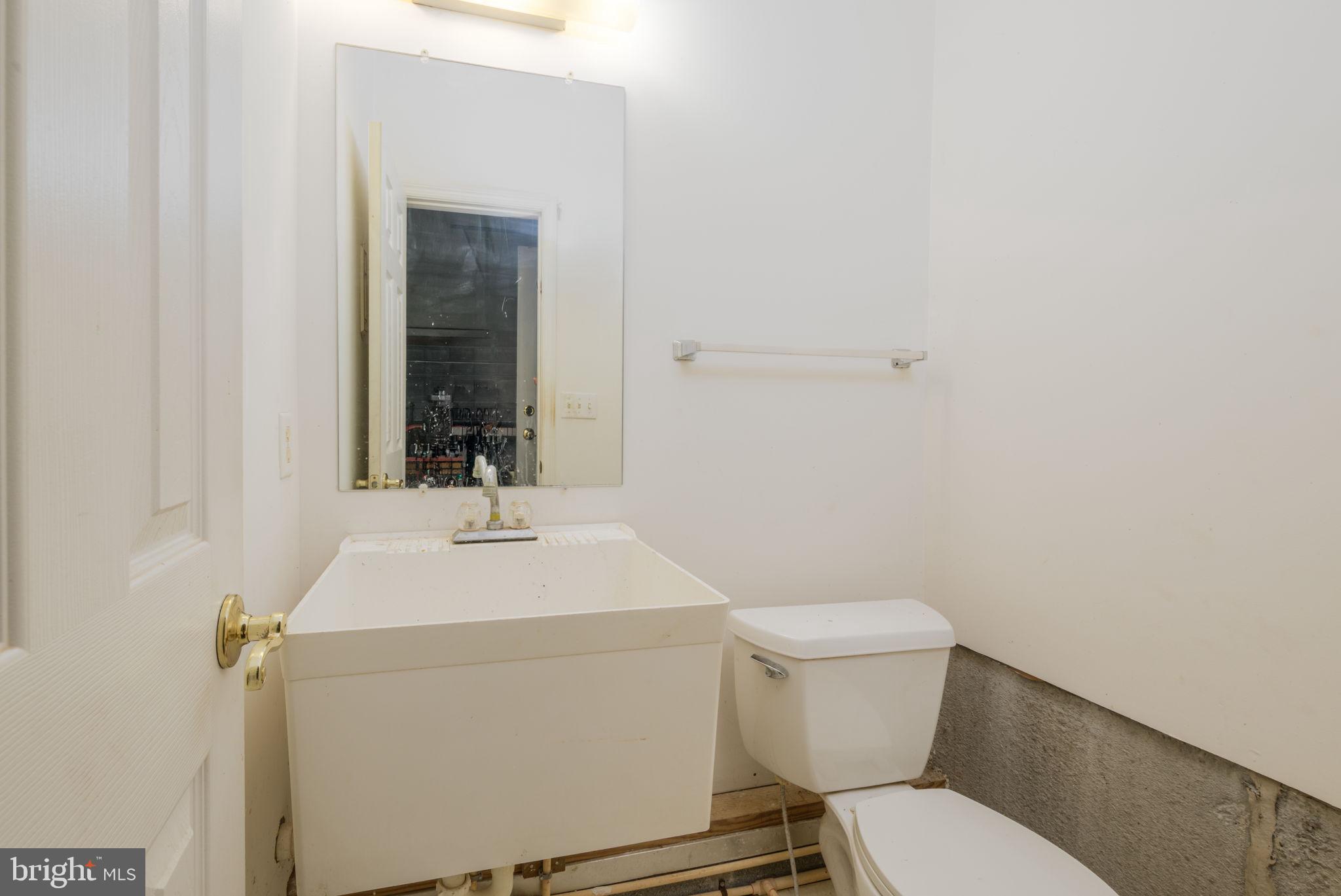 16841 Devon Road Lewes, DE 19958 - Photo 30 of 43 a bathroom with a sink and a toilet