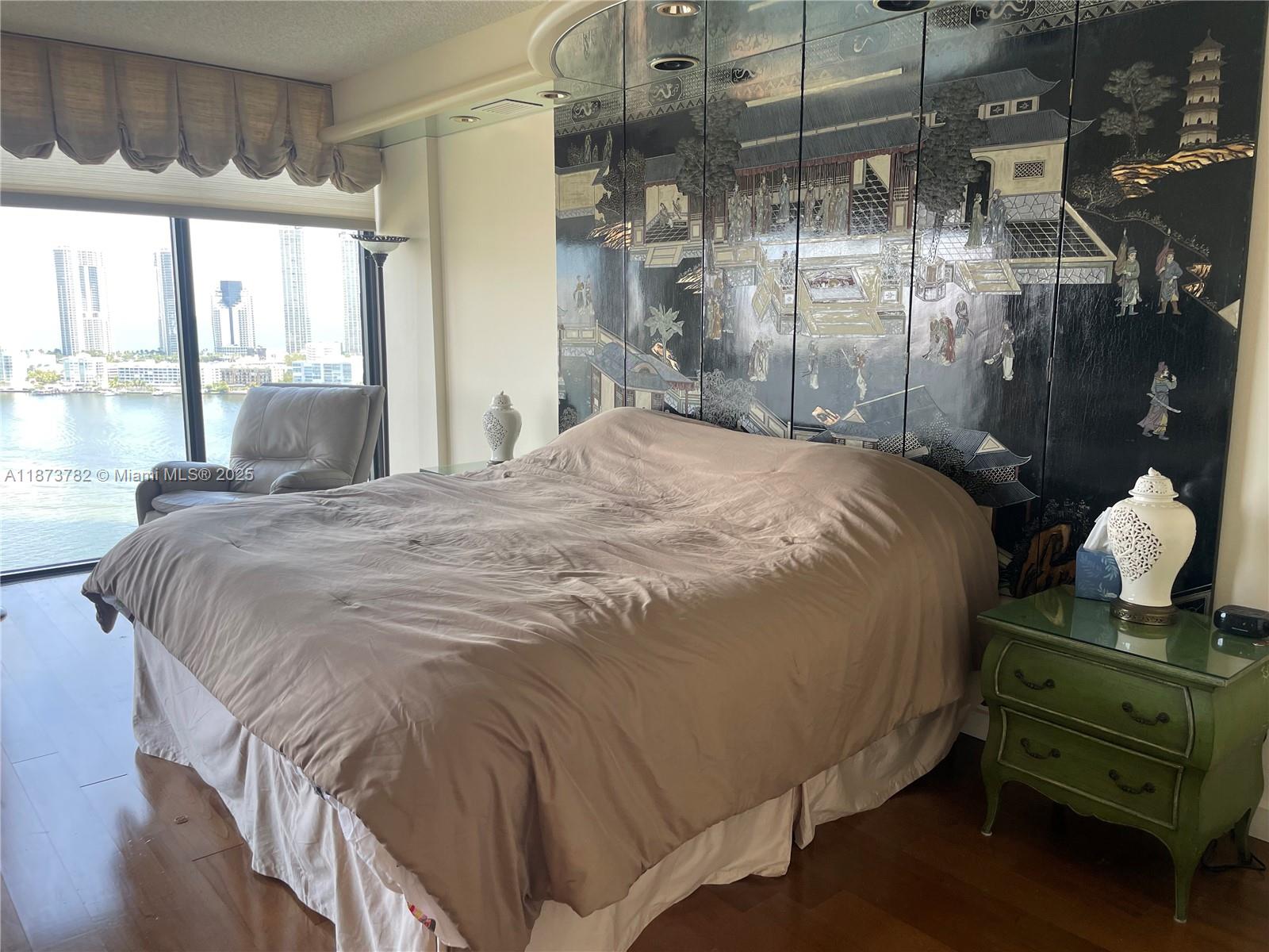 3000 Island Boulevard, Unit 2405 Aventura, FL 33160 - Photo 11 of 26 a bedroom with a bed and a window