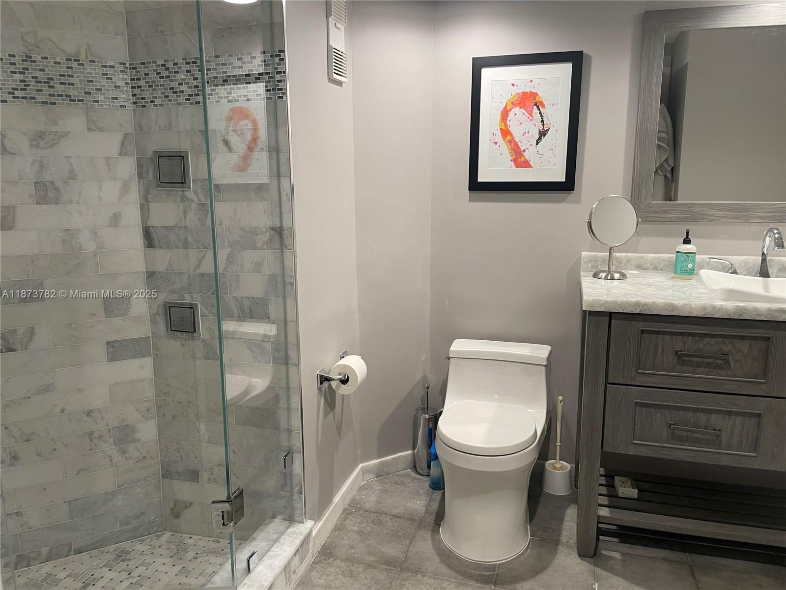 3000 Island Boulevard, Unit 2405 Aventura, FL 33160 - Photo 15 of 26 a bathroom with a toilet and a sink