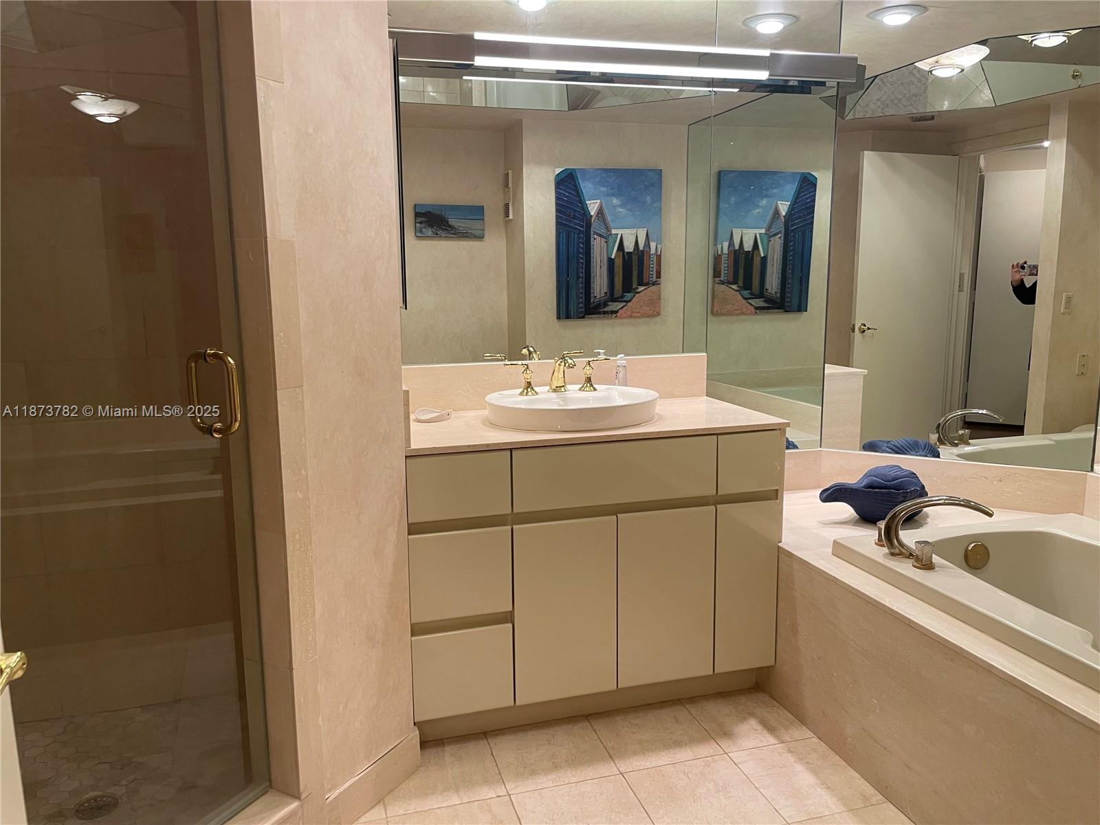 3000 Island Boulevard, Unit 2405 Aventura, FL 33160 - Photo 18 of 26 a bathroom with a sink and a mirror