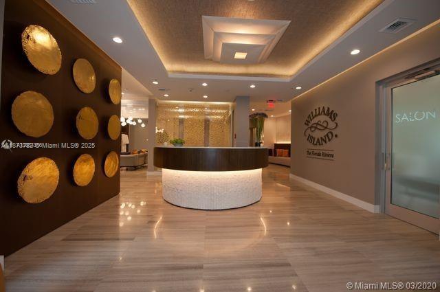 3000 Island Boulevard, Unit 2405 Aventura, FL 33160 - Photo 24 of 26 a large room with wooden floor