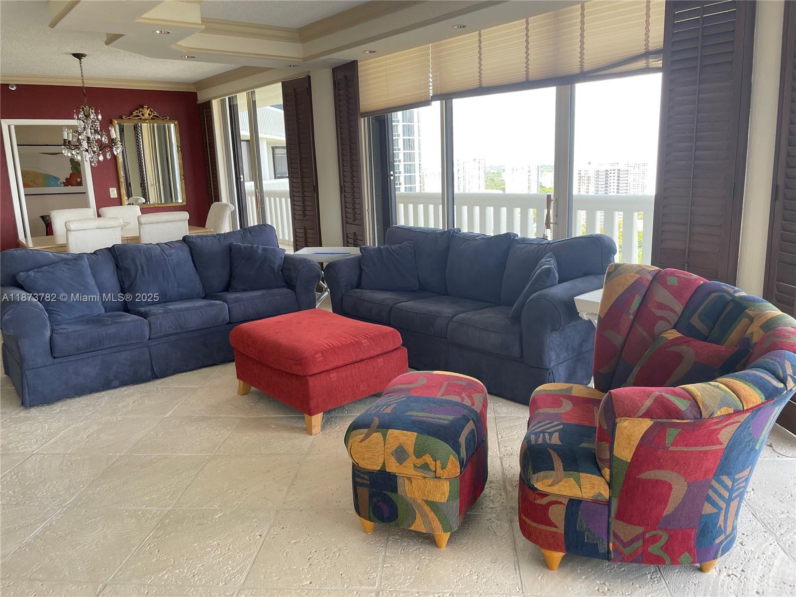 3000 Island Boulevard, Unit 2405 Aventura, FL 33160 - Photo 4 of 26 a living room with furniture and a large window