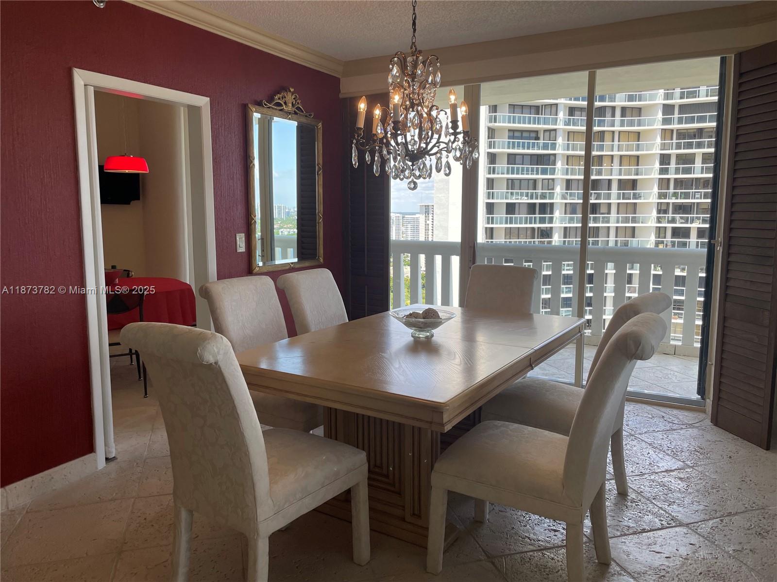 3000 Island Boulevard, Unit 2405 Aventura, FL 33160 - Photo 6 of 26 a view of a dining room with furniture and window