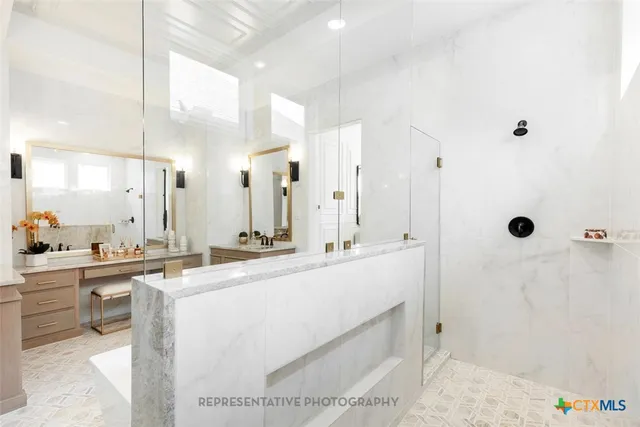 a large white kitchen with a large window