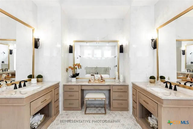a spacious bathroom with a double vanity sink mirror and