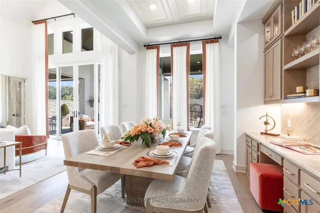a dining room with furniture and window