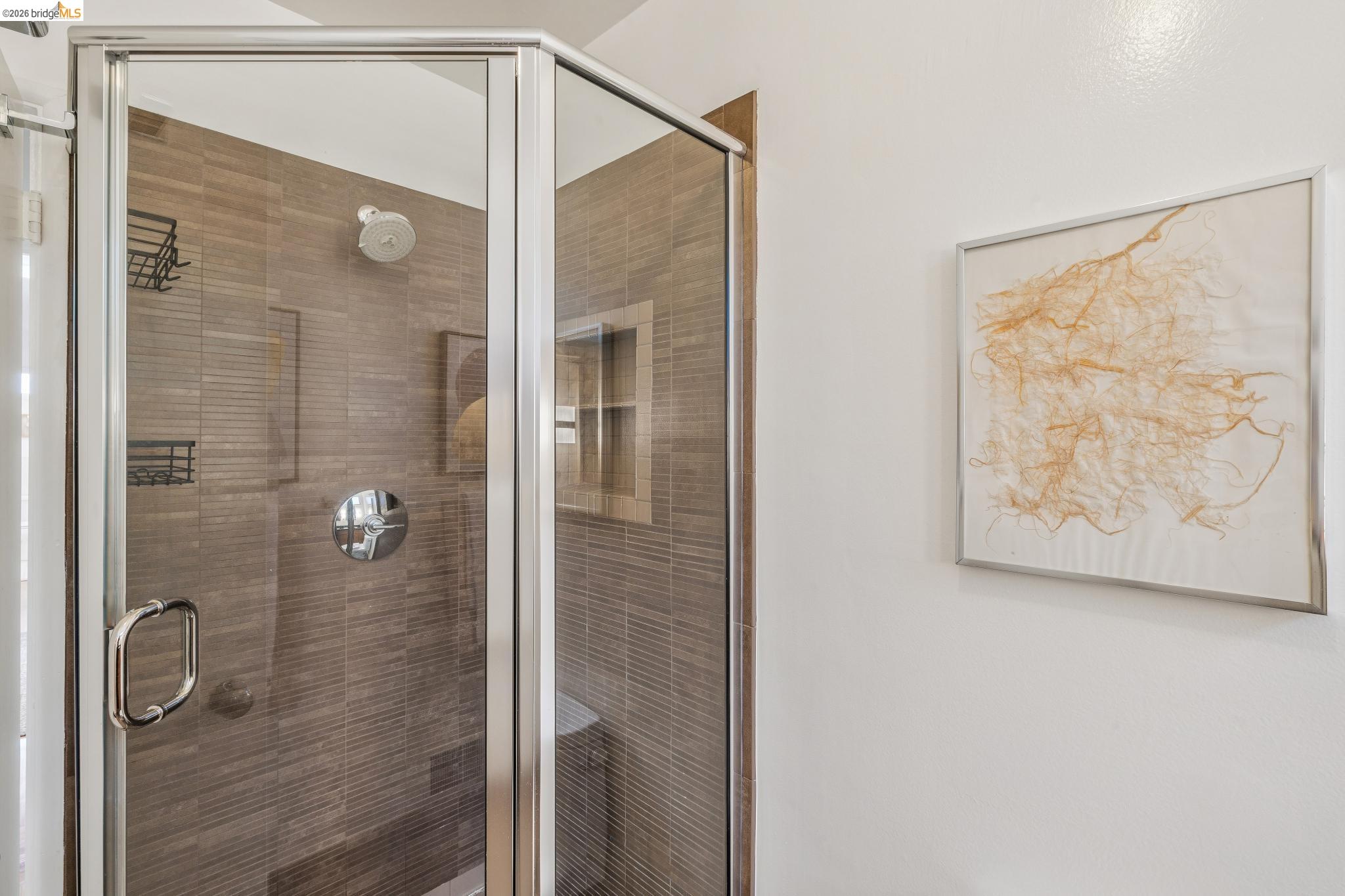 1024 Overlook Road Berkeley, CA 94708 - Photo 32 of 41 Glass-enclosed shower with a built-in niche, integrated bench, and mosaic tile surround