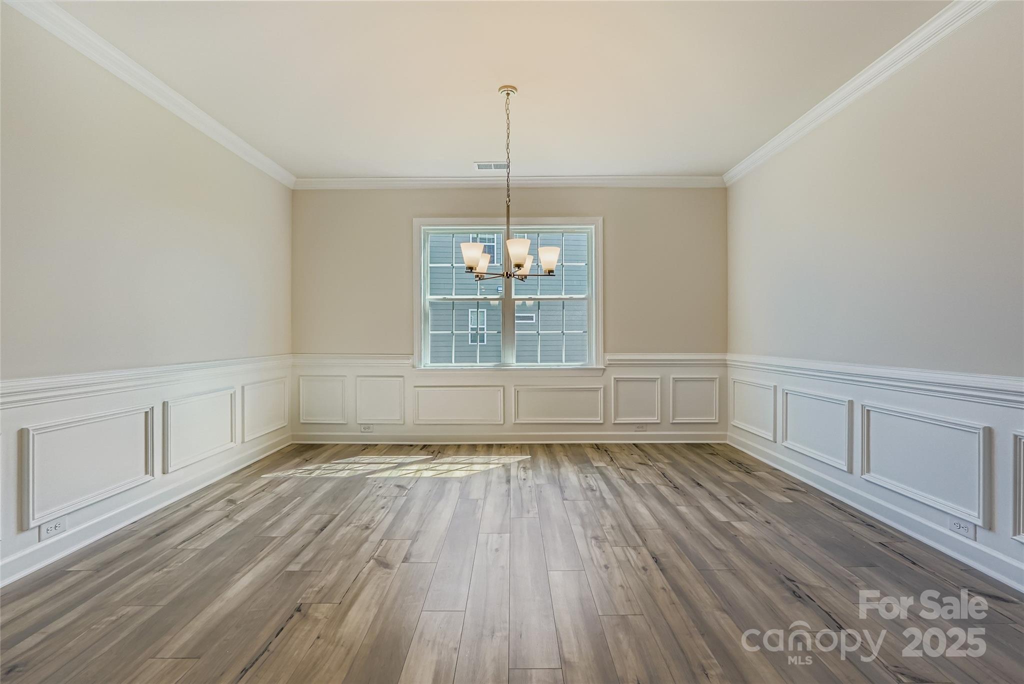 2267 Moon Crst Road Lancaster, SC 29720 - Photo 4 of 17 a view of an empty room with wooden floor and a window