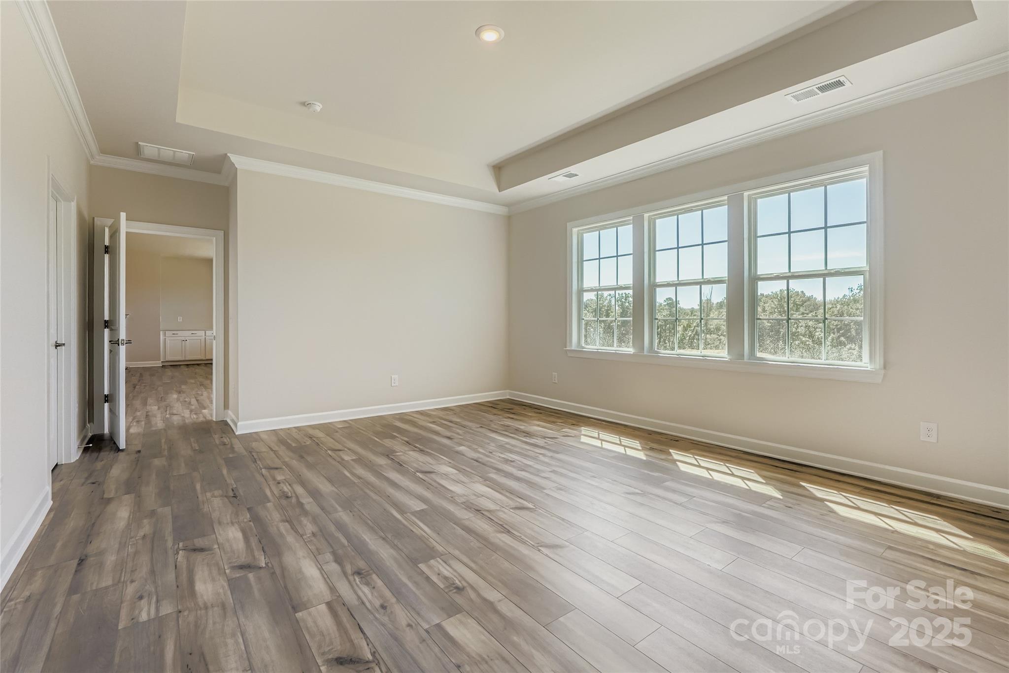 2267 Moon Crst Road Lancaster, SC 29720 - Photo 6 of 17 an empty room with wooden floor and windows