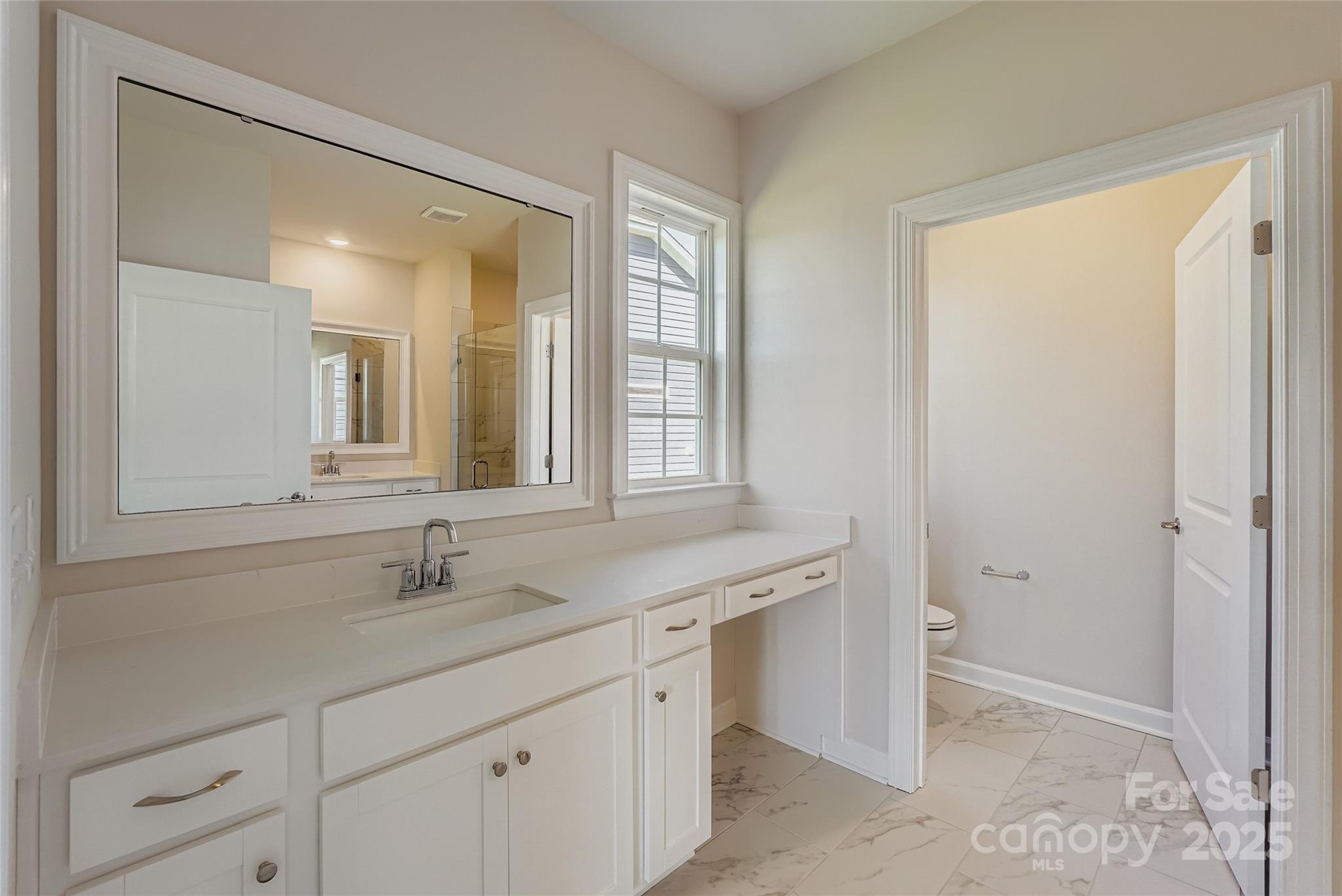 2267 Moon Crst Road Lancaster, SC 29720 - Photo 7 of 17 a bathroom with a double vanity sink and a mirror