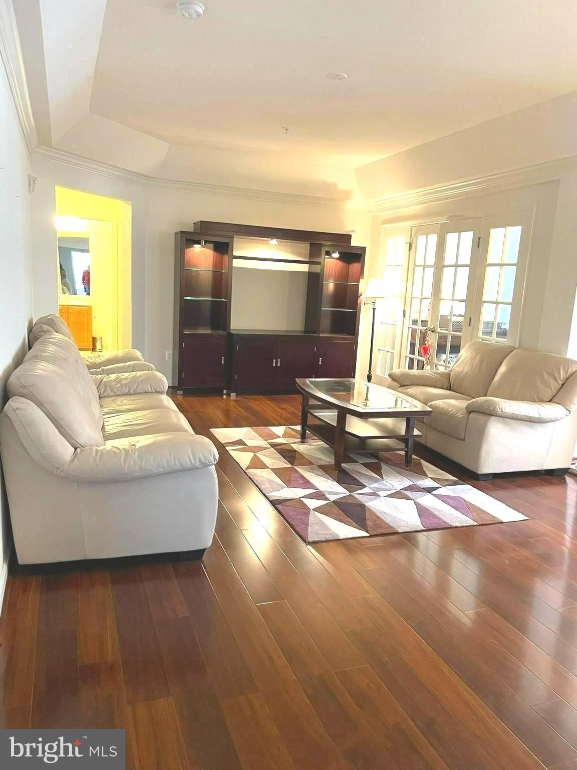 7401 Travertine Drive, Unit 302 Baltimore, MD 21209 - Photo 7 of 28 Living Room with adjoining Den