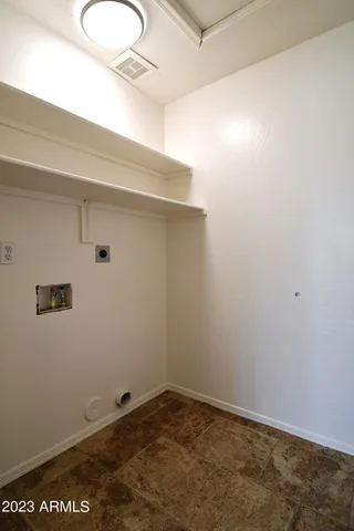 a view of a room with racks on the wall