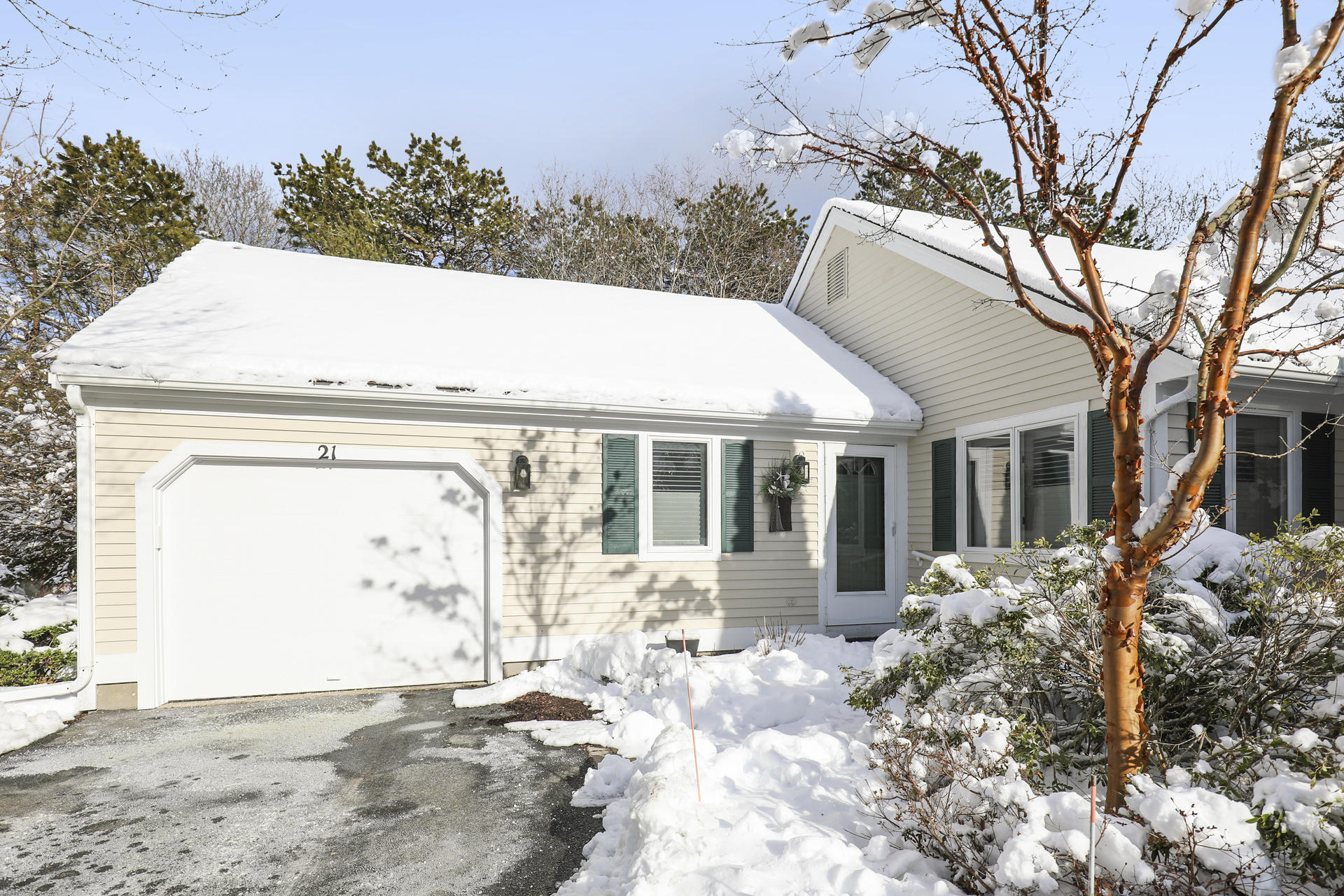 a view of a house with a snow in the yard