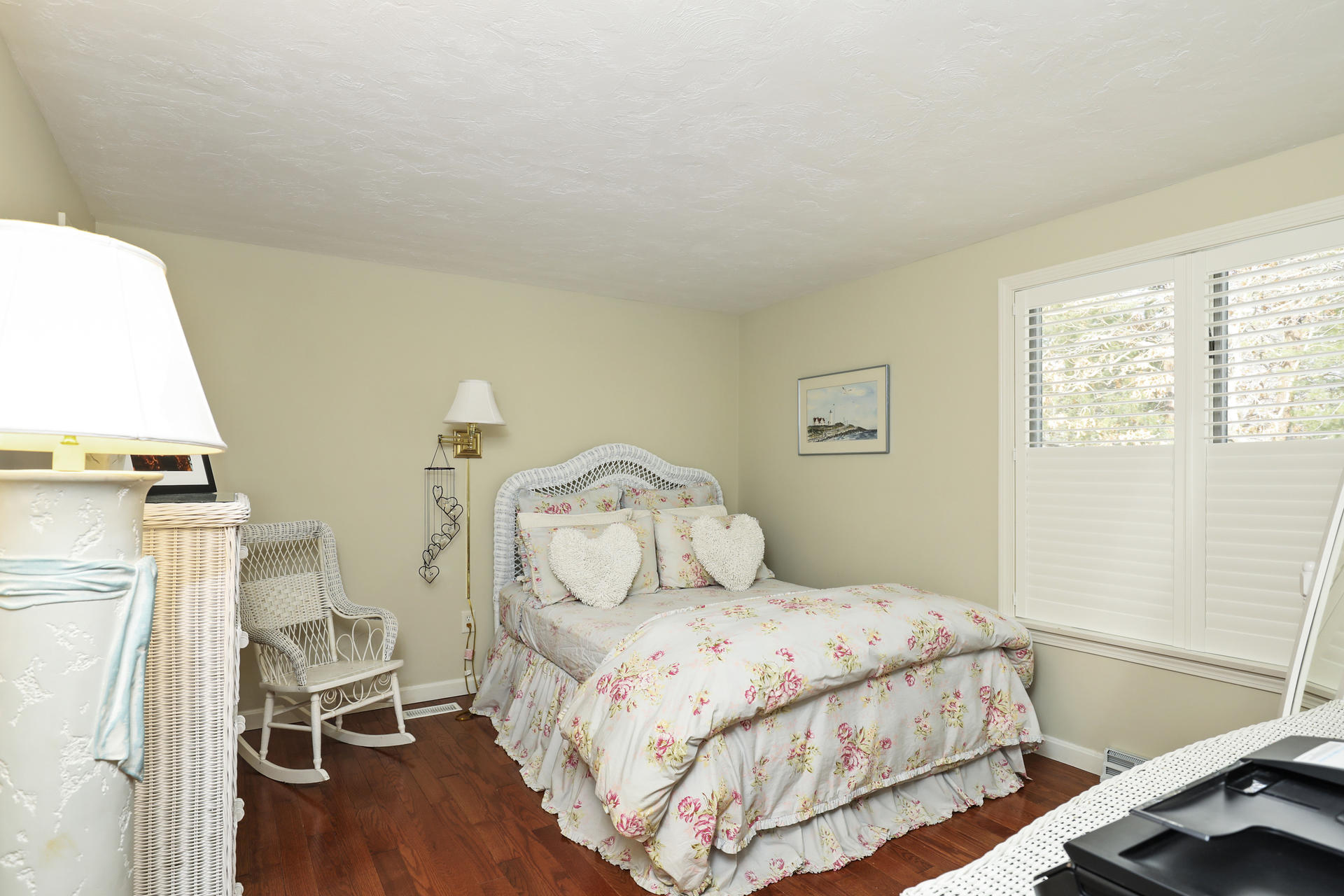 21 Portside Drive Mashpee, MA 02649 - Photo 11 of 20 a bedroom with a bed and wooden floor