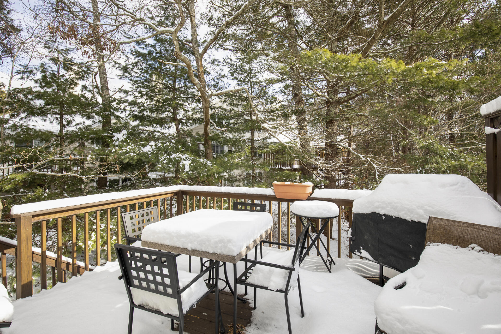 21 Portside Drive Mashpee, MA 02649 - Photo 18 of 20 a view of a patio with a table and chairs